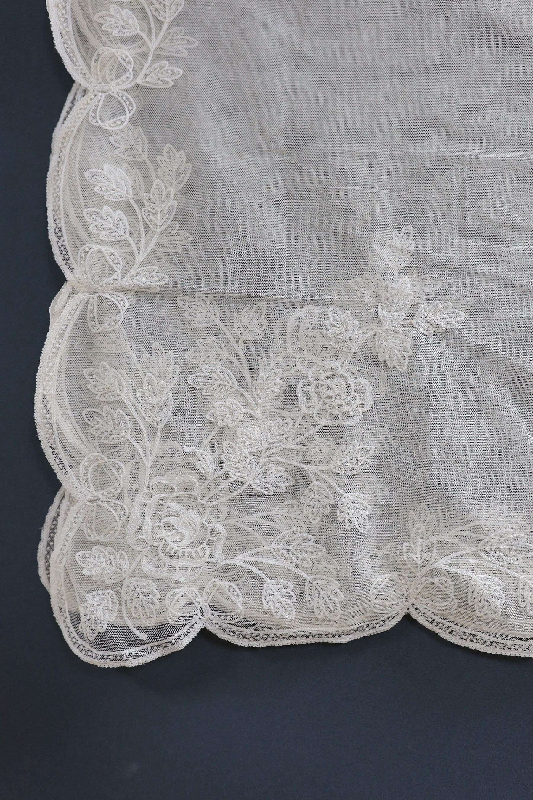 An early 20th century machine lace wedding veil, 120 cms x 186 cms